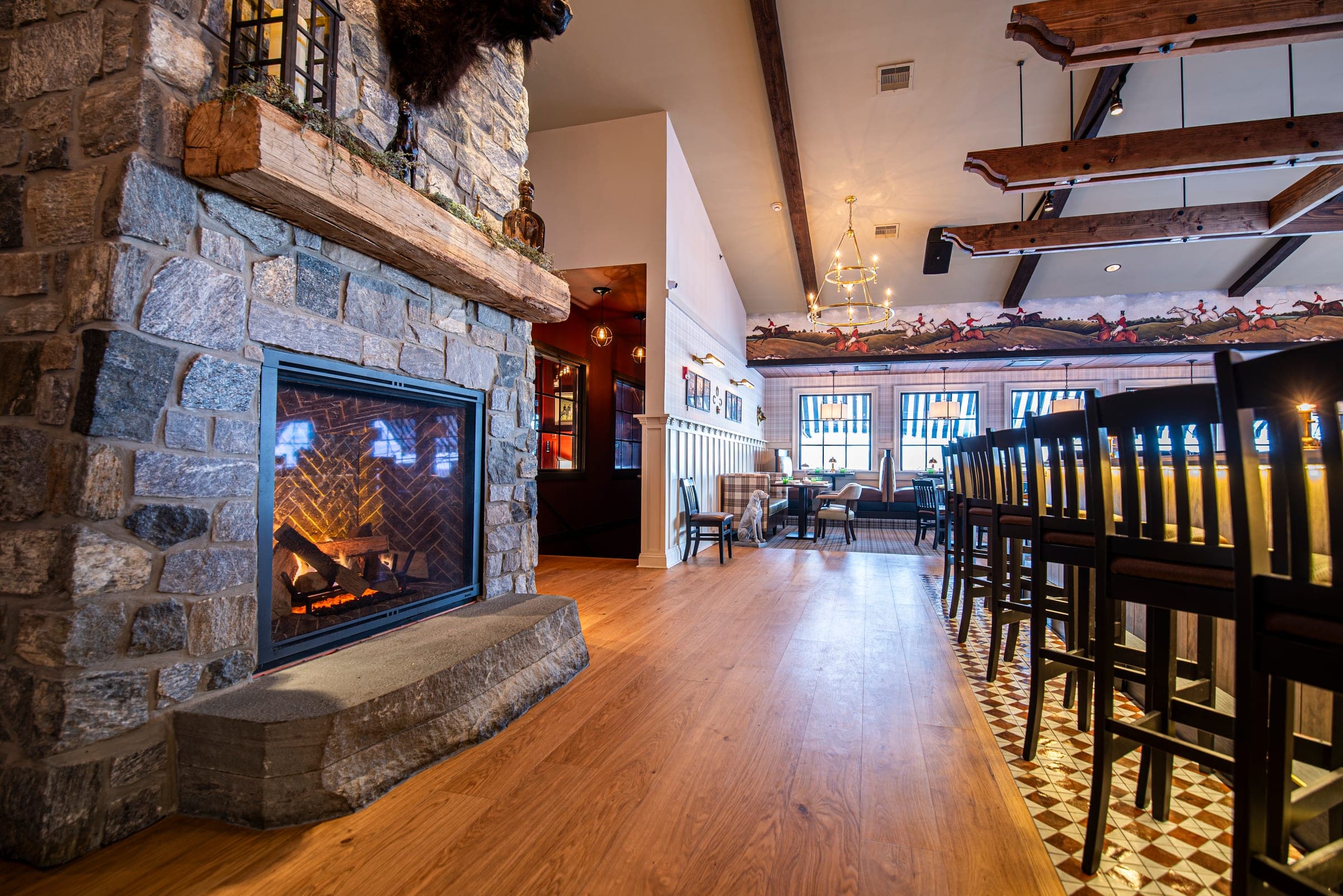 The stone fireplace beside the bar at The Jockey Tavern, Malvern, PA