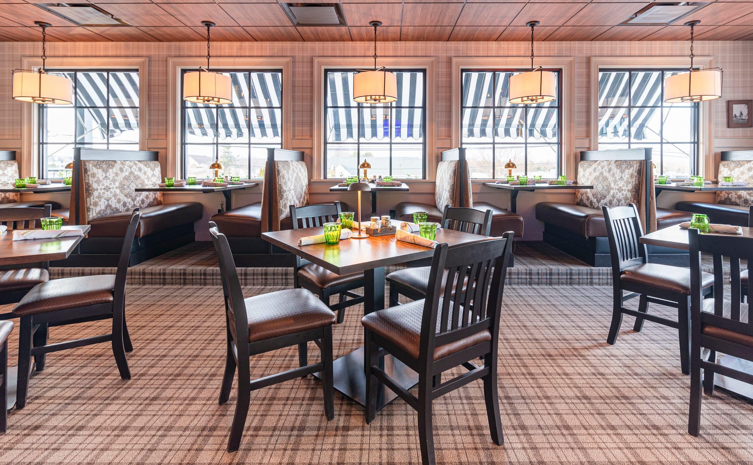 The dining room under striped awnings at The Jockey Tavern, Malvern, PA